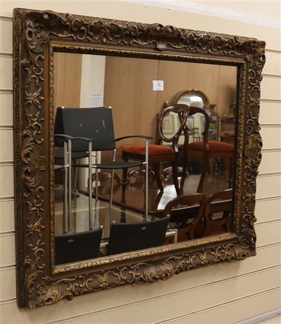 A gilt carved wood and composite wall mirror W.97cm